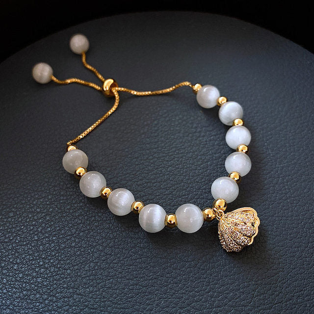 Pulsera de Concha con Perlas en Oro