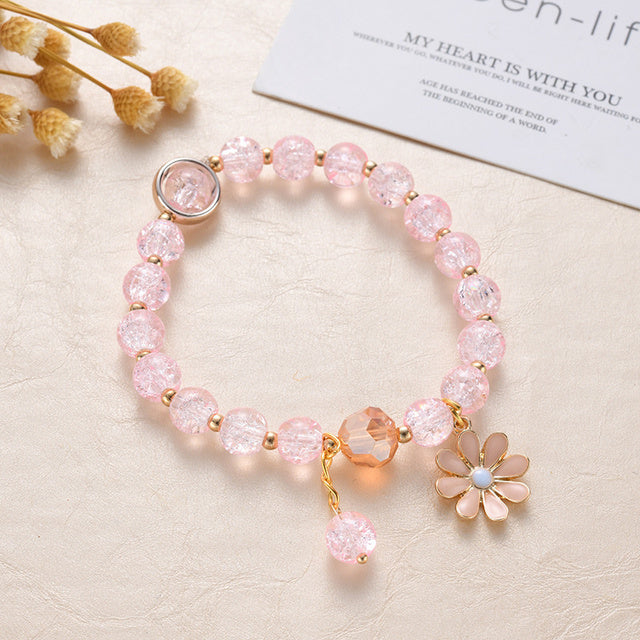 Pulsera de Piedras Rosas y Flor de Margarita en Oro