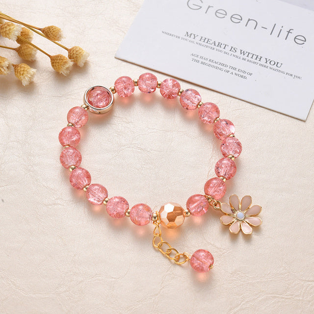 Pulsera de Piedras Rojas y Flor de Margarita en Oro