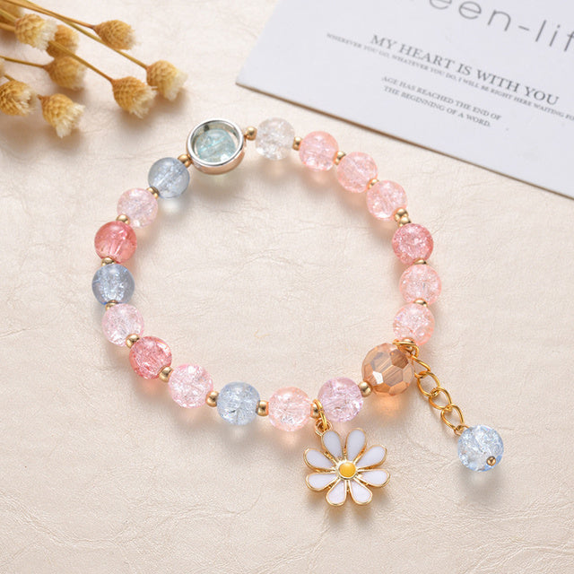 Pulsera de Piedras Rosas y Azules y Flor de Margarita en Oro